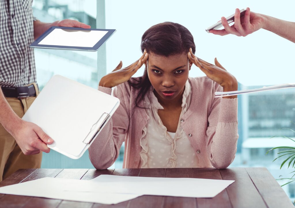 5 Common B-BBEE Mistakes Businesses Make, And How to Avoid Them conceptual image of businesswoman frustrated due to work load