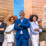 portrait of a multi ethnic business team standing proud outdoors